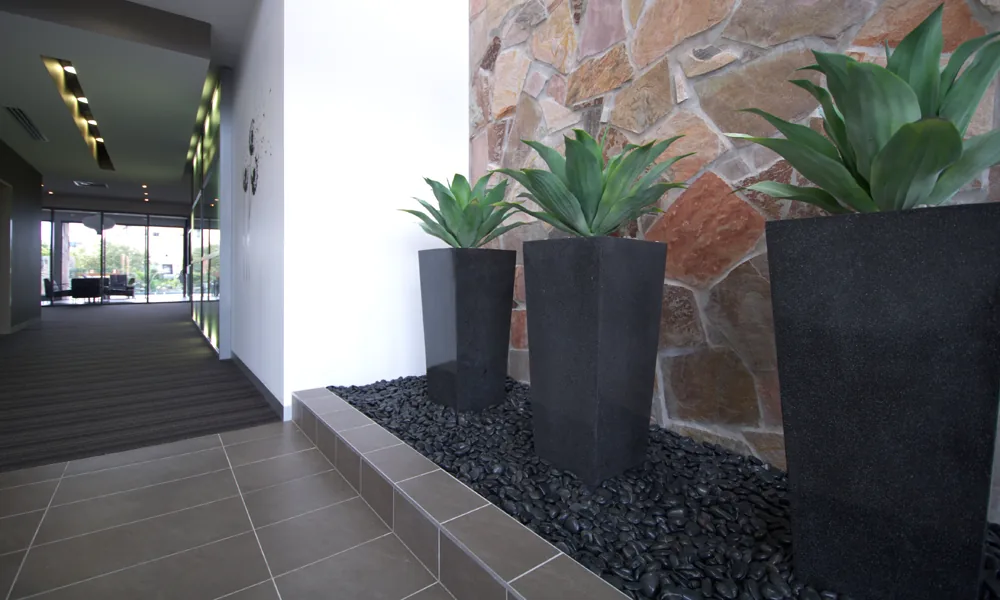 Stone feature wall and floor tiling from C and K Tiling's published gallery